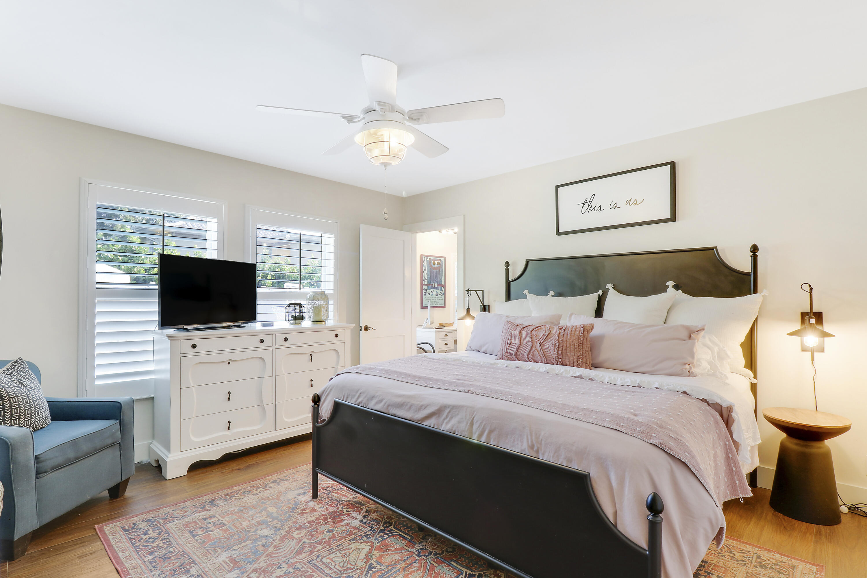 342 Country Club Drive Tequesta, FL 33469 - Photo 29 of 67 a bedroom with a bed and a flat screen tv