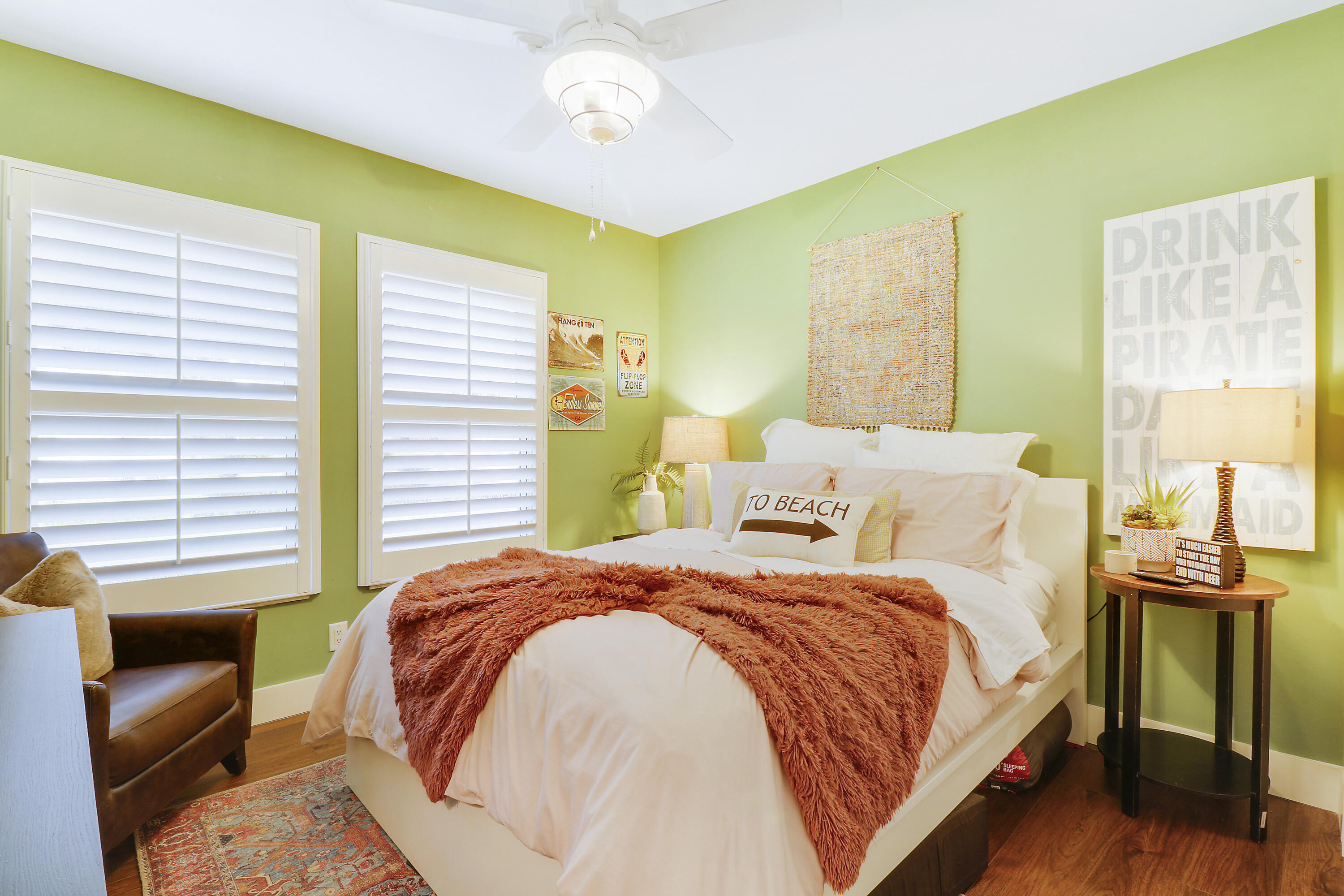 342 Country Club Drive Tequesta, FL 33469 - Photo 33 of 67 a bedroom with a bed and wooden floor