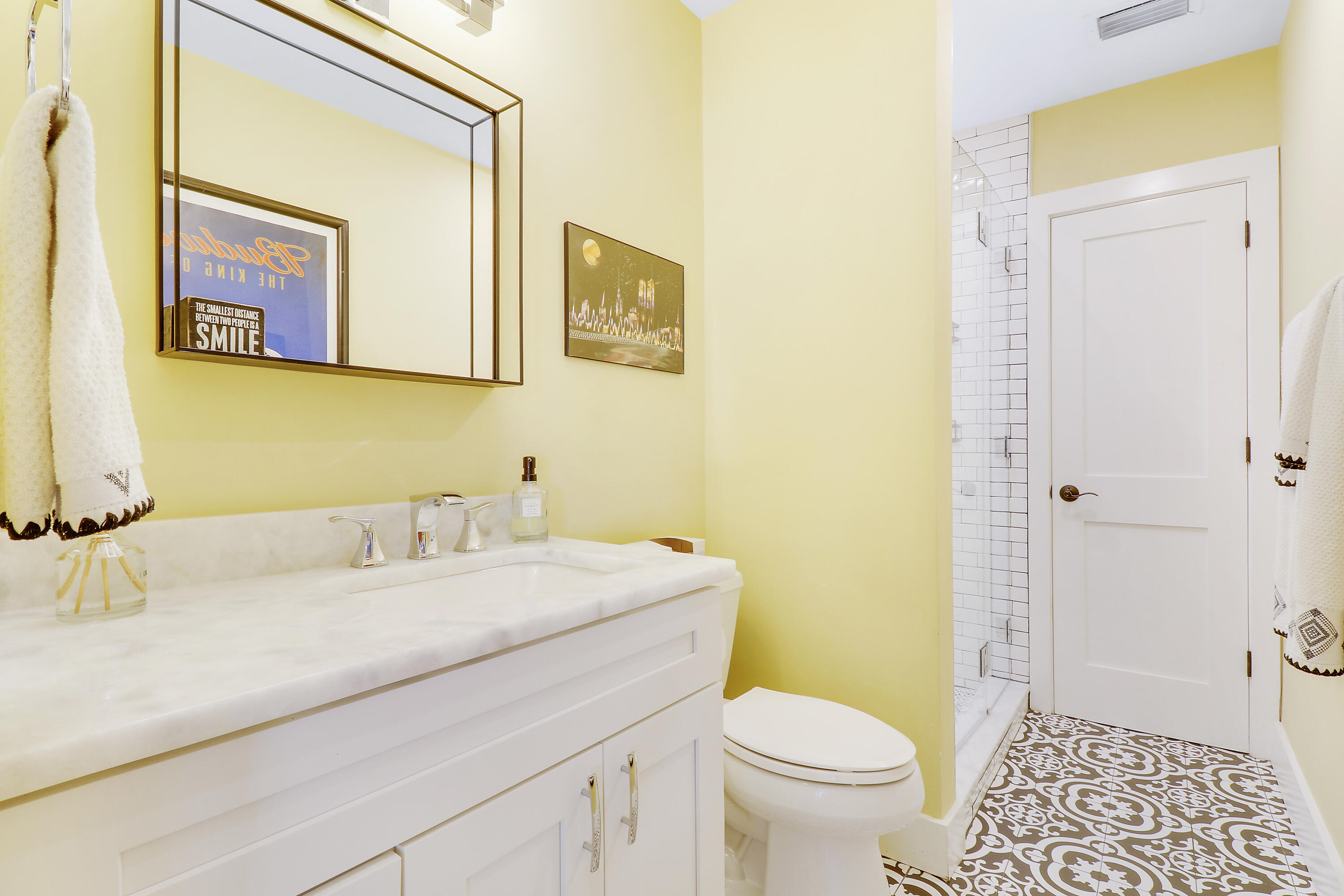 342 Country Club Drive Tequesta, FL 33469 - Photo 35 of 67 a bathroom with a granite countertop sink mirror vanity and toilet