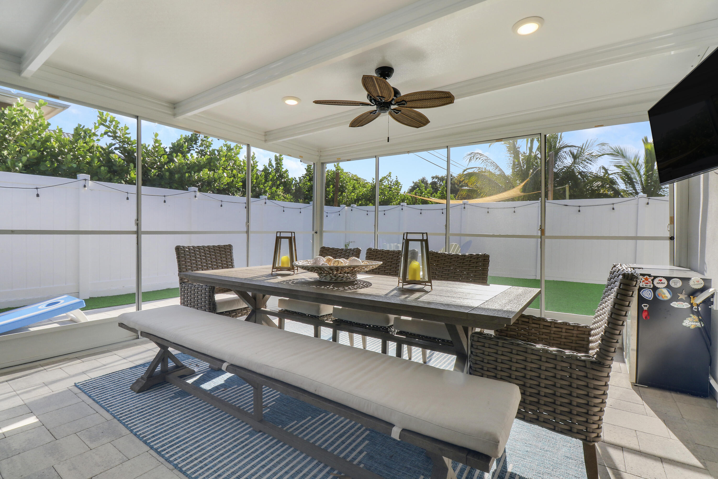 342 Country Club Drive Tequesta, FL 33469 - Photo 42 of 67 a view of a patio with a dining table and chairs