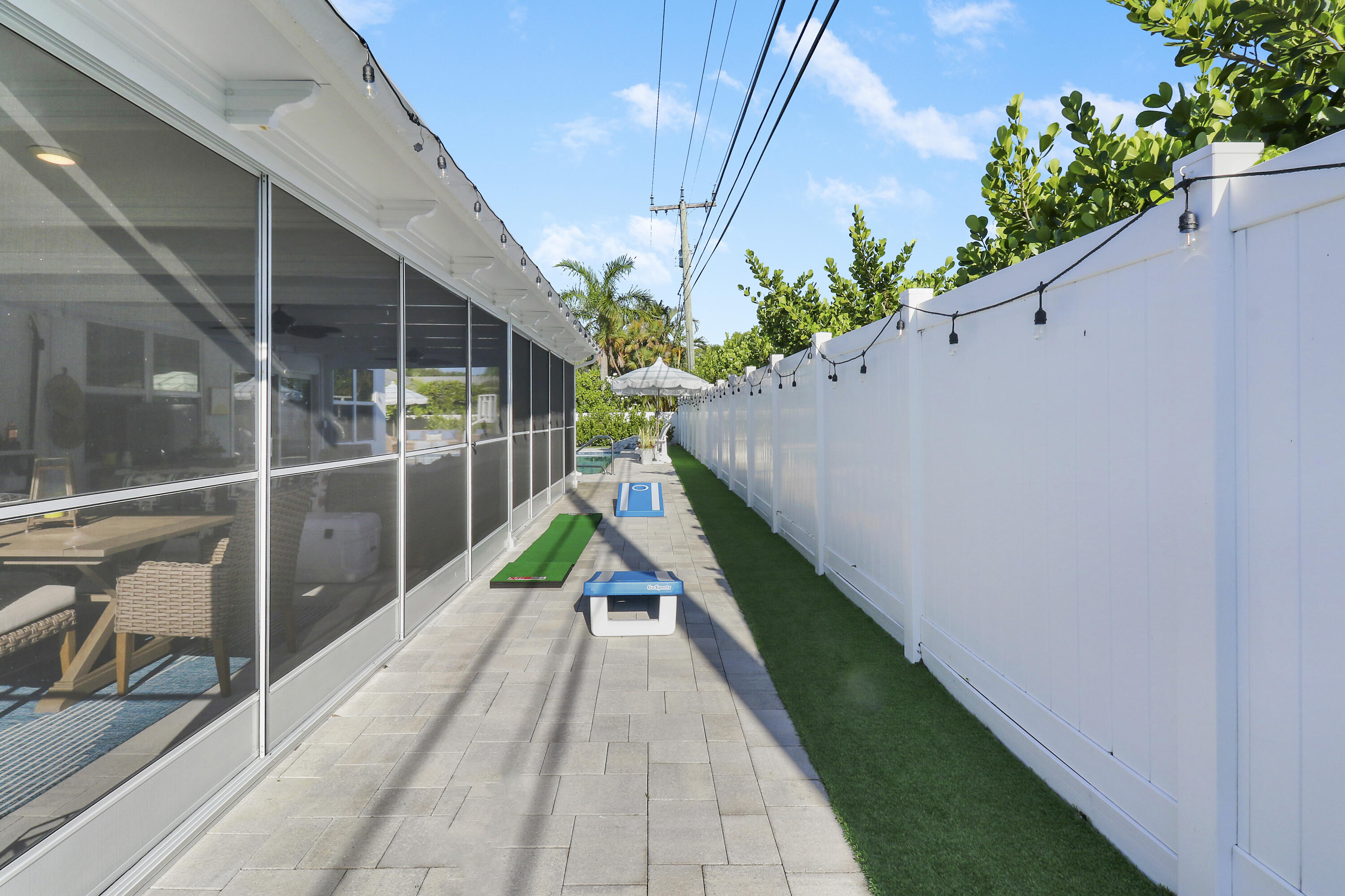 342 Country Club Drive Tequesta, FL 33469 - Photo 44 of 67 Side yard / corn hole!