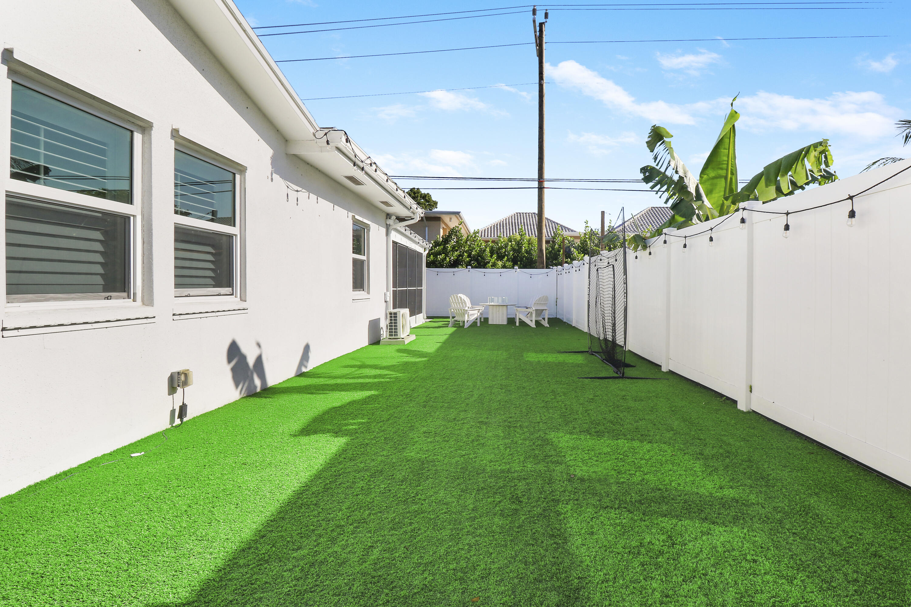 342 Country Club Drive Tequesta, FL 33469 - Photo 46 of 67 a view of an house with backyard and garden