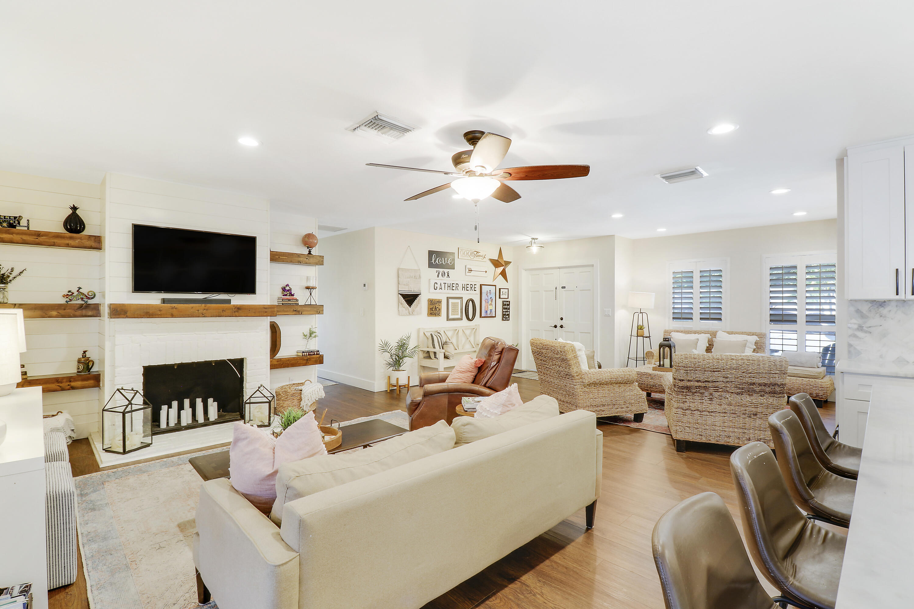 342 Country Club Drive Tequesta, FL 33469 - Photo 66 of 67 a living room with furniture fireplace and flat screen tv