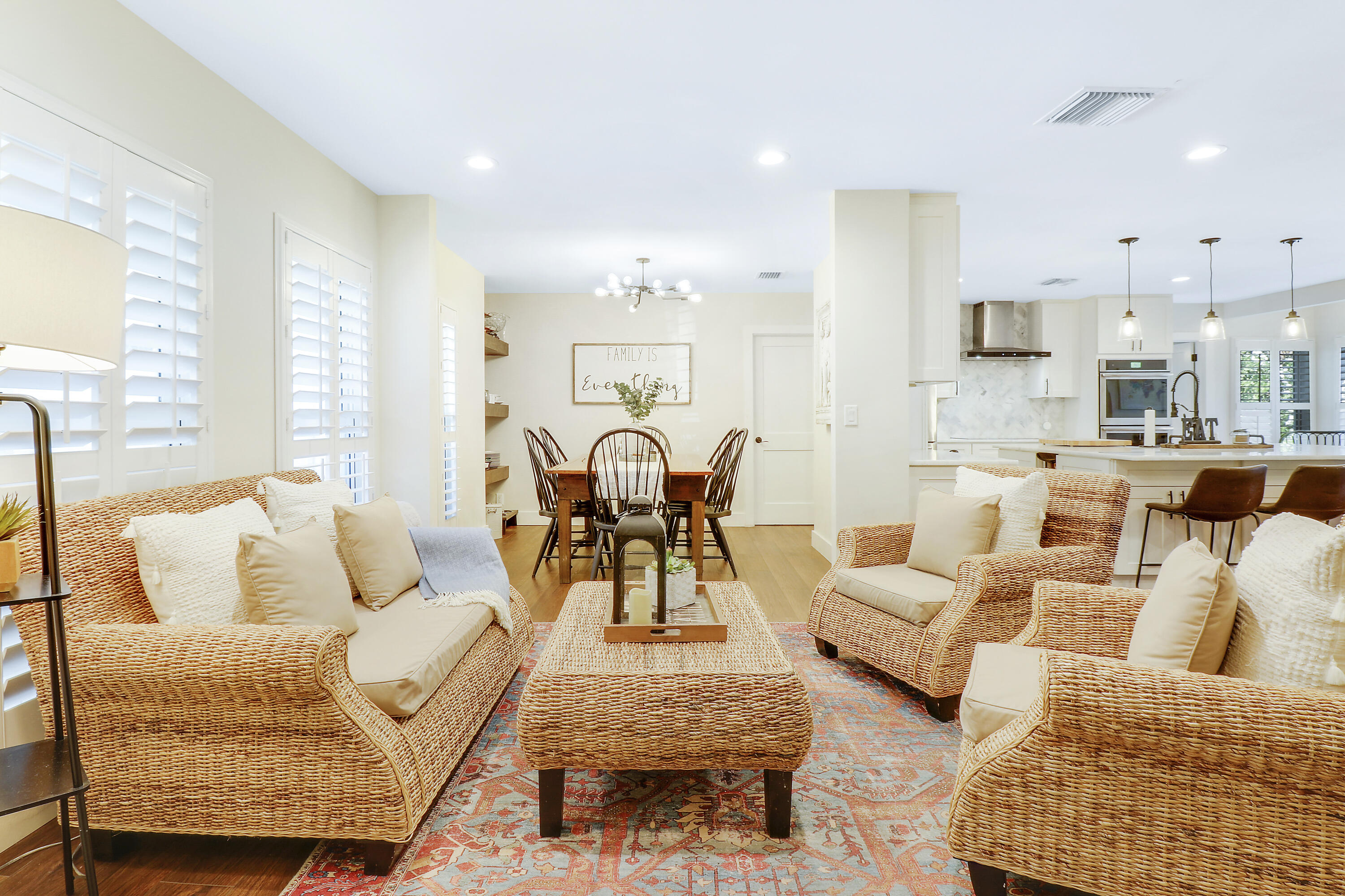 342 Country Club Drive Tequesta, FL 33469 - Photo 7 of 67 a living room with furniture and kitchen view
