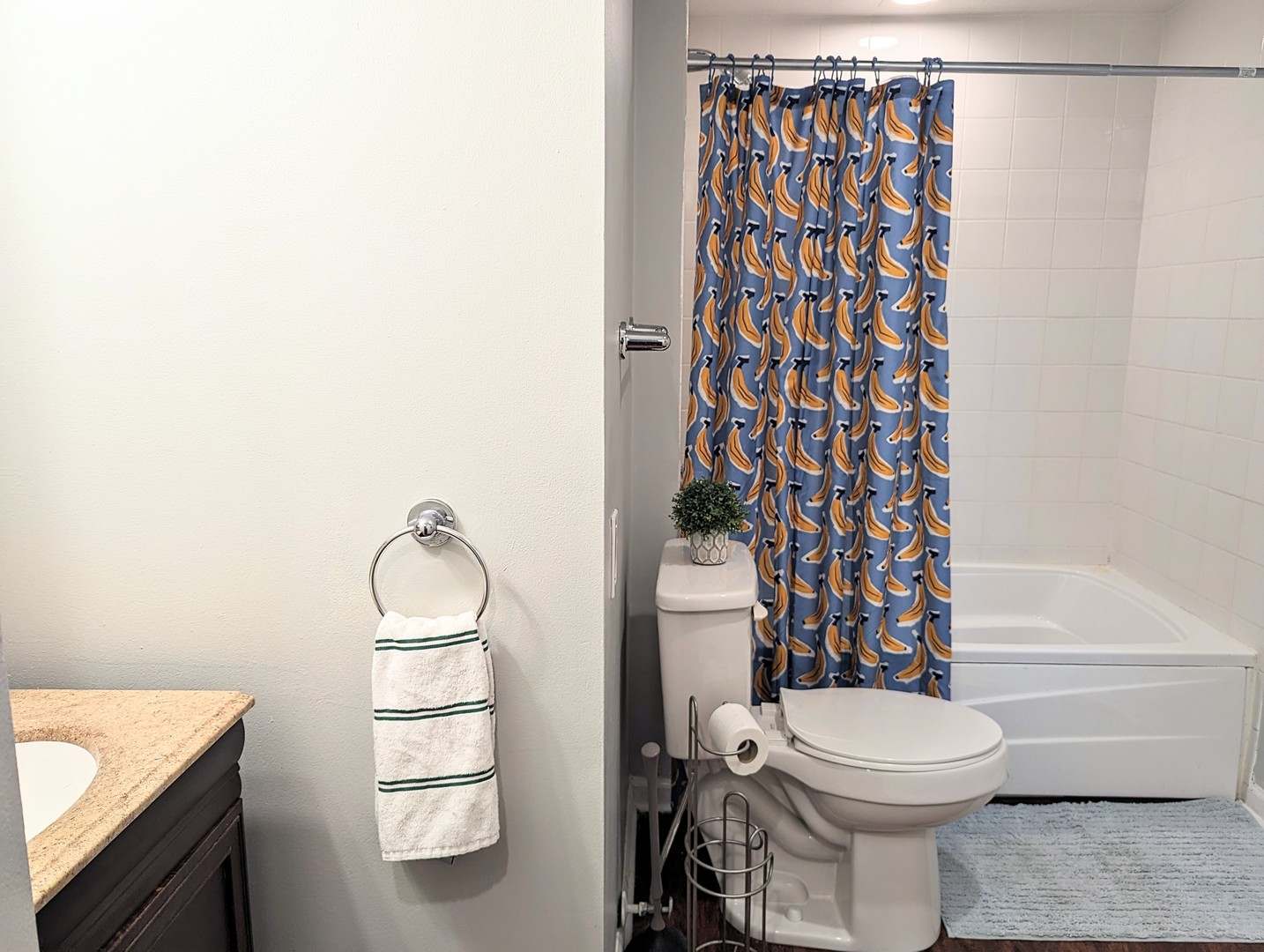 724 South Oakley Boulevard, Unit 1 Chicago, IL 60612 - Photo 16 of 22 a bathroom with a toilet and a shower curtain