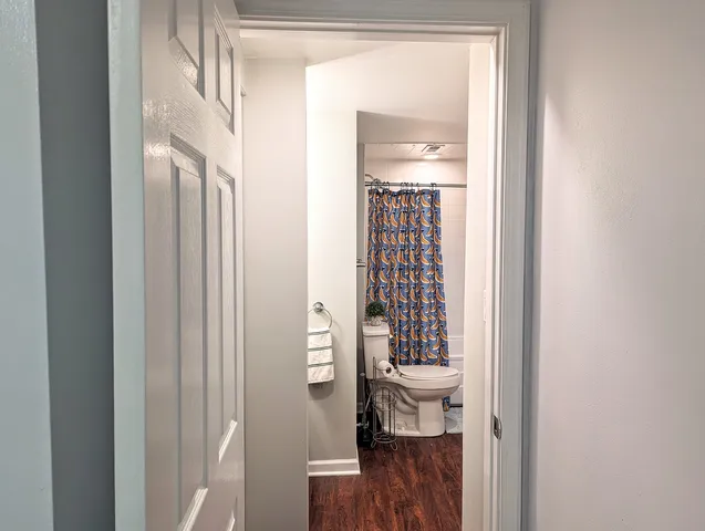 a view of a bathroom from a hallway