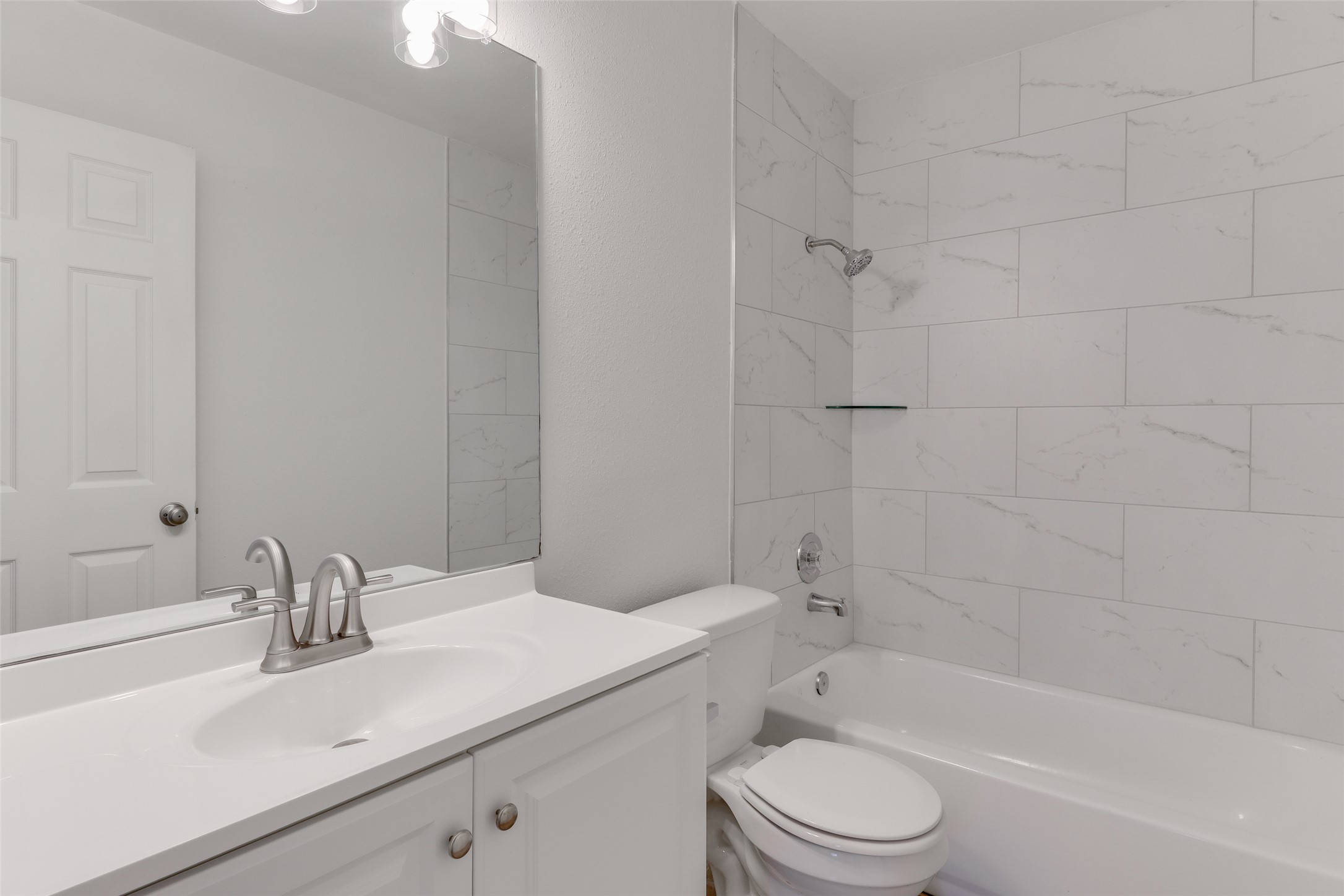 300 Tamara Drive, Unit A Georgetown, TX 78628 - Photo 11 of 12 a bathroom with a sink toilet and shower