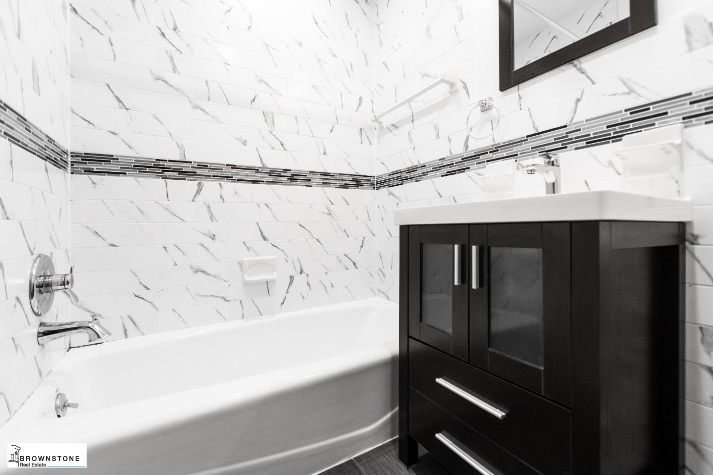 459 77th Street, Unit 3 Brooklyn, NY 11209 - Photo 9 of 9 a bathroom with a bathtub and shower