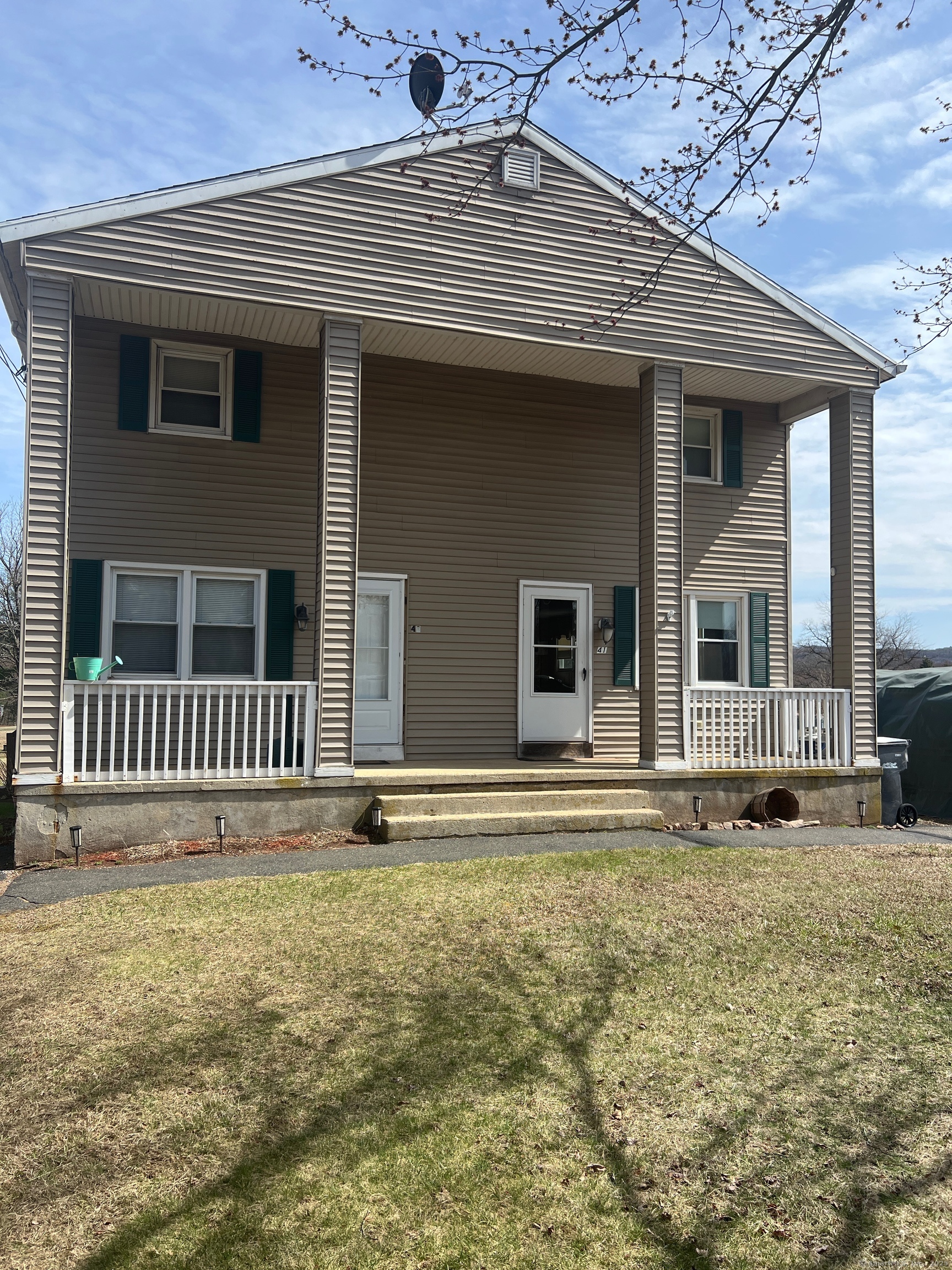 front view of a house with a yard