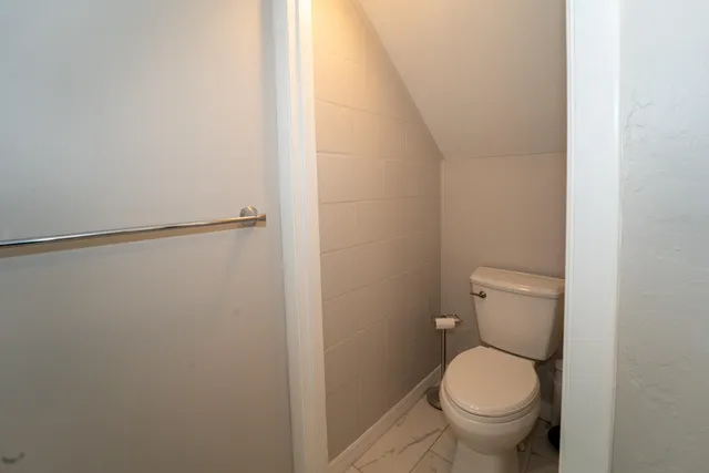 a bathroom with a shower a sink and a mirror