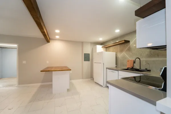 a view of a kitchen and a window