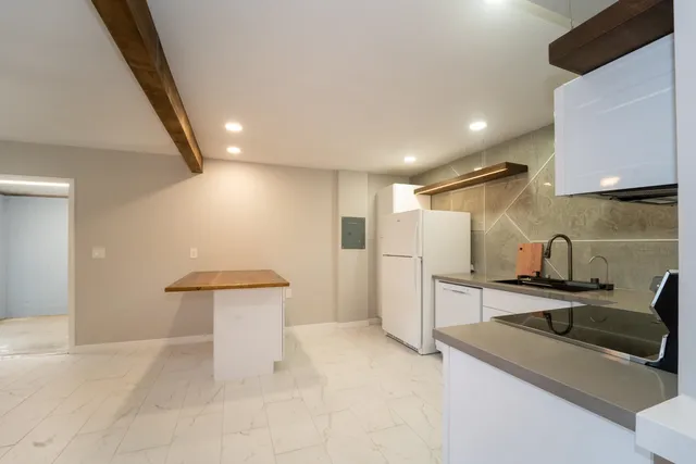 a view of a kitchen and a window