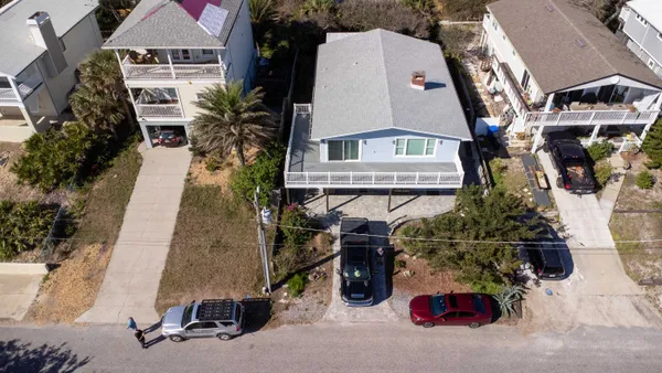 an aerial view of residential houses with outdoor space