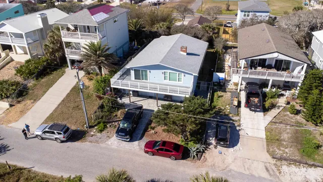 a view of a house with a patio and a yard