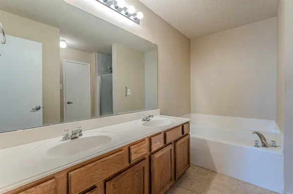 a bathroom with a bathtub and a sink