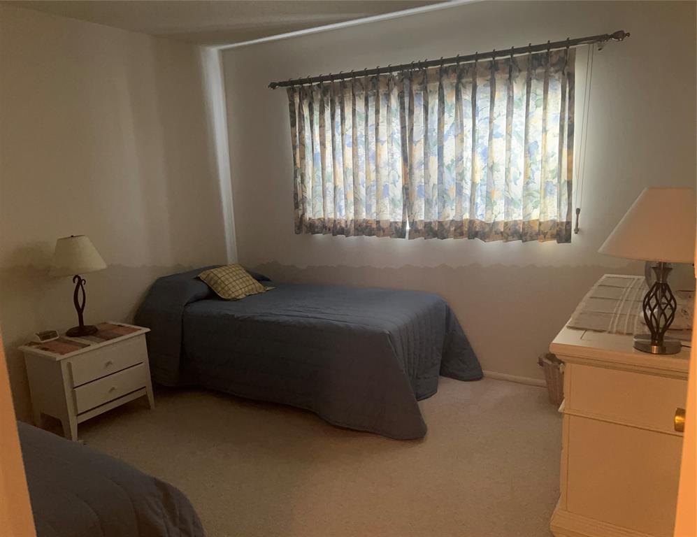 1425 Atlantic Shores Boulevard, Unit 601 Hallandale Beach, FL 33009 - Photo 19 of 23 a bedroom with a bed and windows