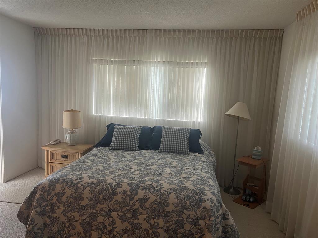 1425 Atlantic Shores Boulevard, Unit 601 Hallandale Beach, FL 33009 - Photo 10 of 23 a bedroom with a bed and a window