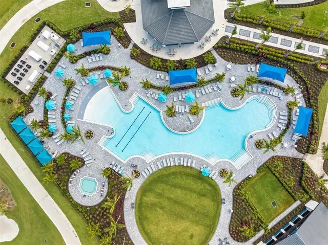 a view of a swimming pool with a lounge chairs