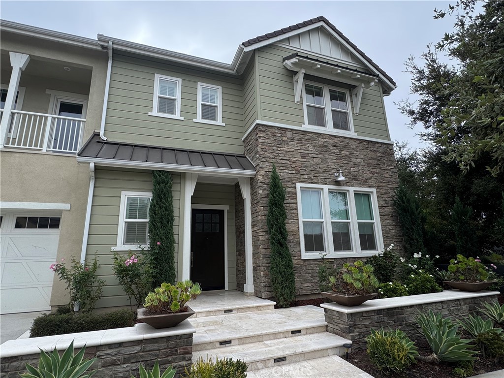114 Crossover Irvine, CA 92618 - Photo 2 of 41 a front view of a house with a yard