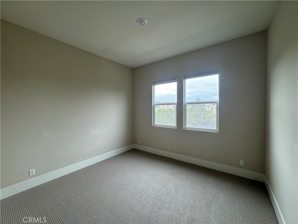 114 Crossover Irvine, CA 92618 - Photo 21 of 41 an empty room with a window