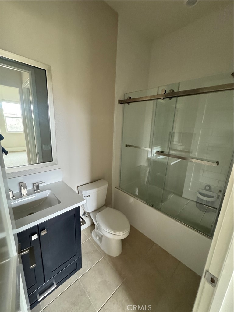 114 Crossover Irvine, CA 92618 - Photo 22 of 41 a bathroom with a granite countertop sink toilet and shower