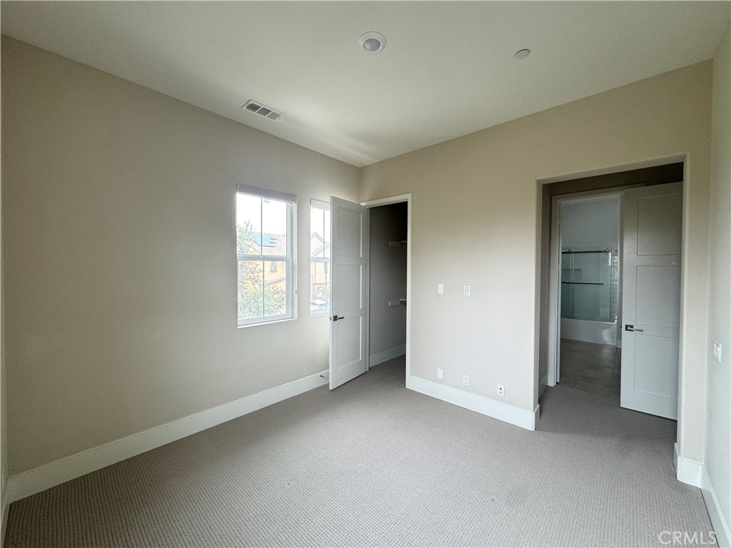 114 Crossover Irvine, CA 92618 - Photo 26 of 41 a view of an empty room with a window