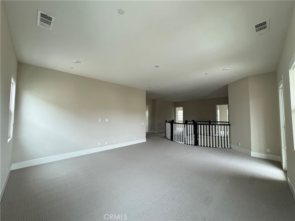 114 Crossover Irvine, CA 92618 - Photo 30 of 41 a view of a livingroom with stairs and a window
