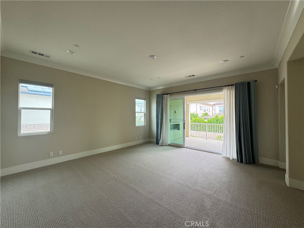 114 Crossover Irvine, CA 92618 - Photo 32 of 41 a view of a big room with windows and chandelier fan