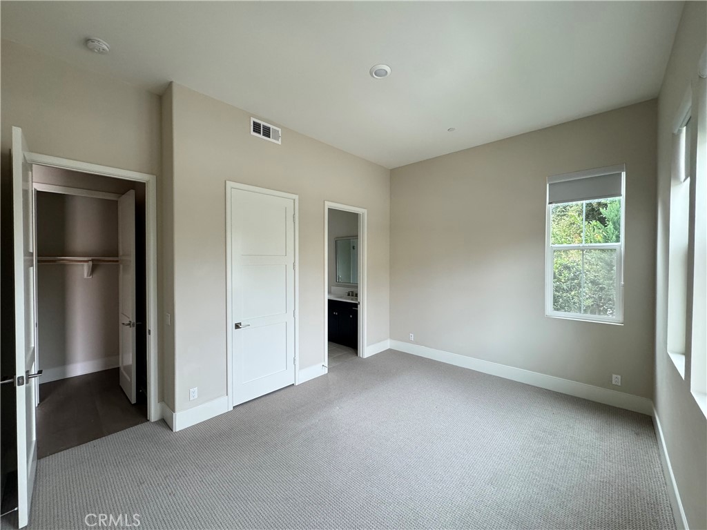 114 Crossover Irvine, CA 92618 - Photo 5 of 41 a view of an empty room with a window