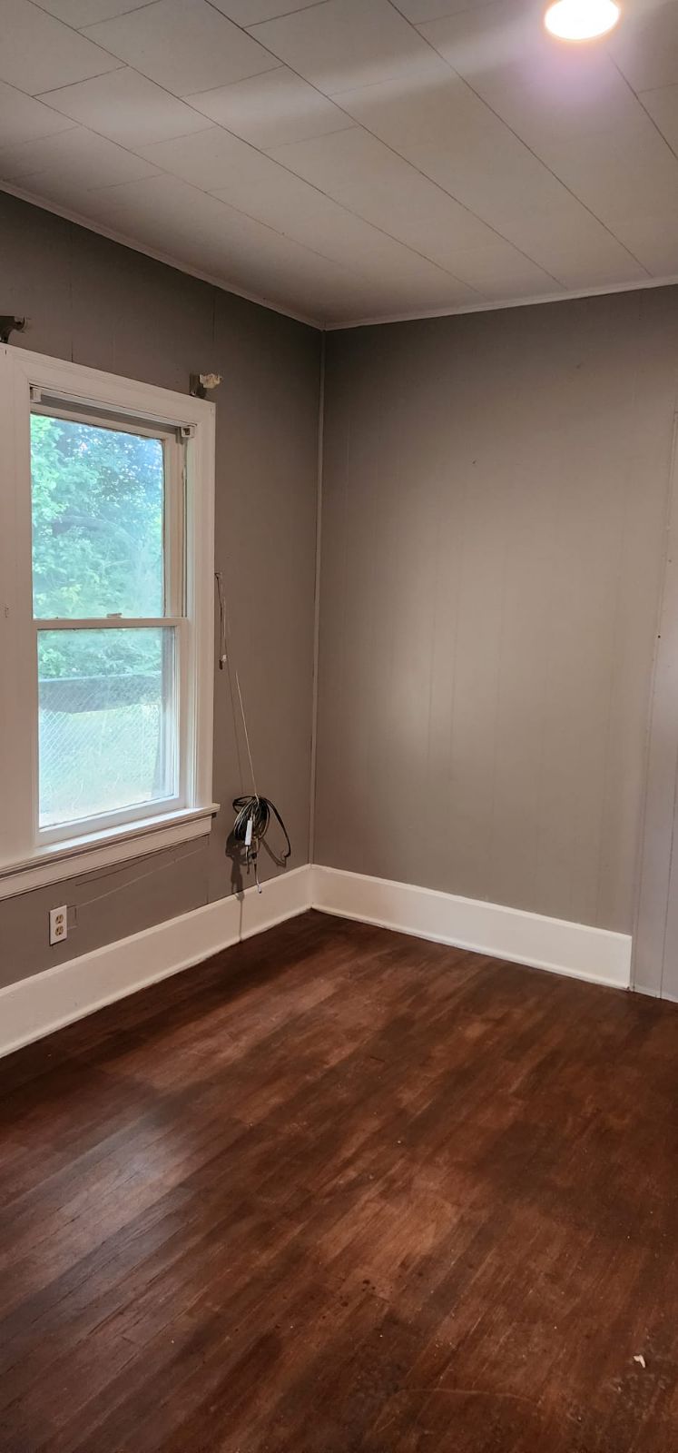 18327 Blake Manor Road, Unit A Manor, TX 78653 - Photo 17 of 21 Unfurnished room with dark wood-style floors