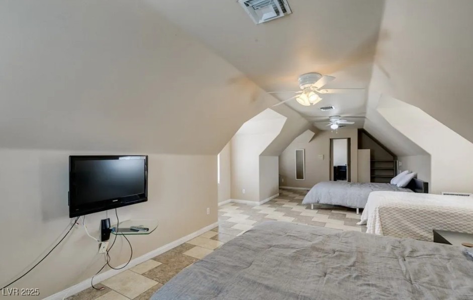 6520 Turtle Hill Road Las Vegas, NV 89110 - Photo 28 of 59 Bedroom featuring ceiling fan and vaulted ceiling