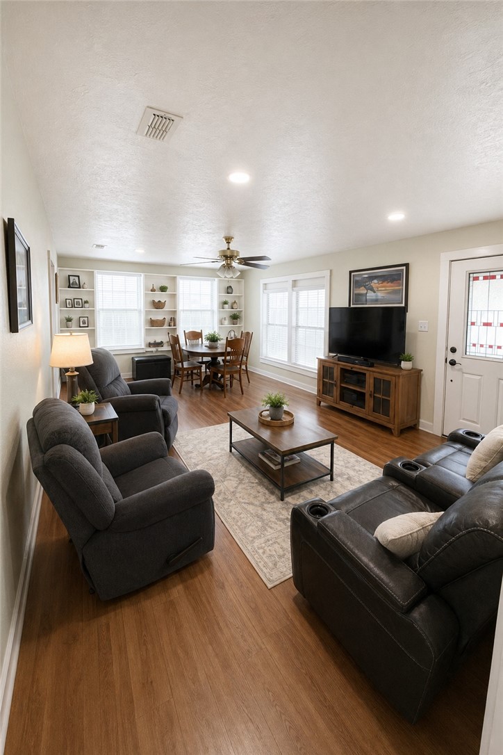 421 South Commerce Street Centerville, TX 75833 - Photo 8 of 23 a living room with furniture and a flat screen tv