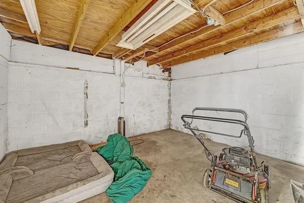 a bedroom with a bed and a mirror