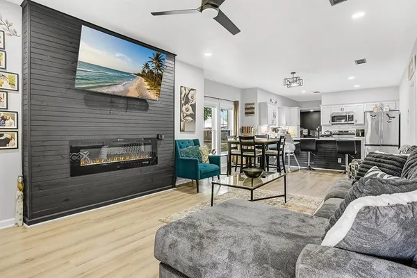 a living room with furniture and a fireplace
