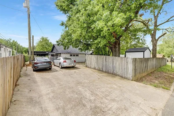 a view of a car parked in front of a house