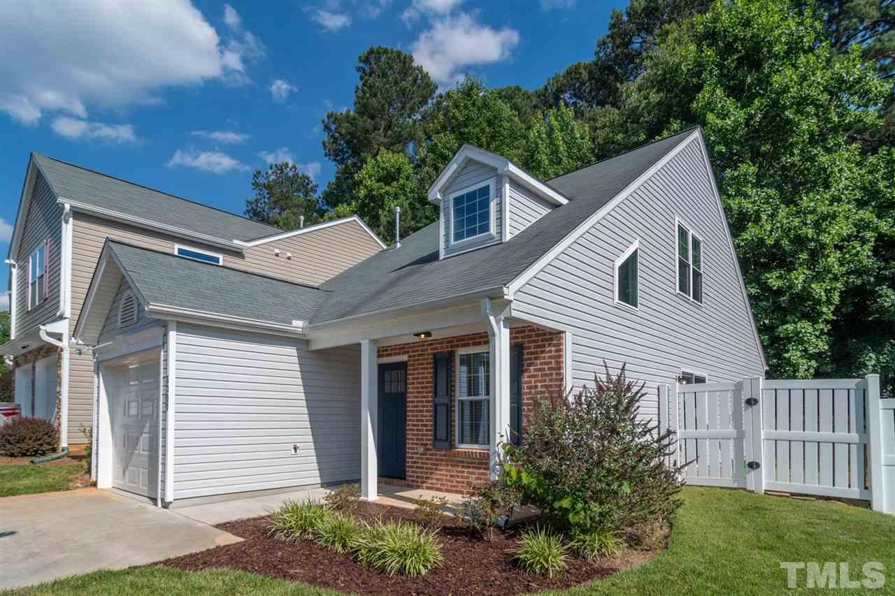 5309 Golden Moss Trail Raleigh, NC 27613 - Photo 2 of 25 a view of a house with a yard plants and large tree