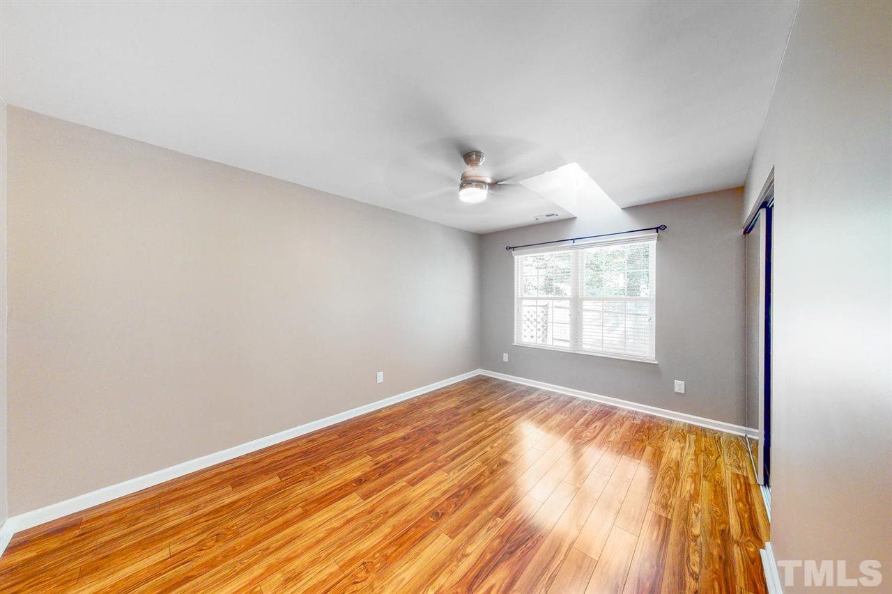 5309 Golden Moss Trail Raleigh, NC 27613 - Photo 12 of 25 wooden floor in an empty room with a window