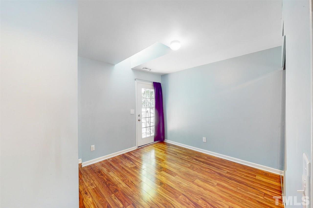5309 Golden Moss Trail Raleigh, NC 27613 - Photo 13 of 25 a view of empty room with wooden floor