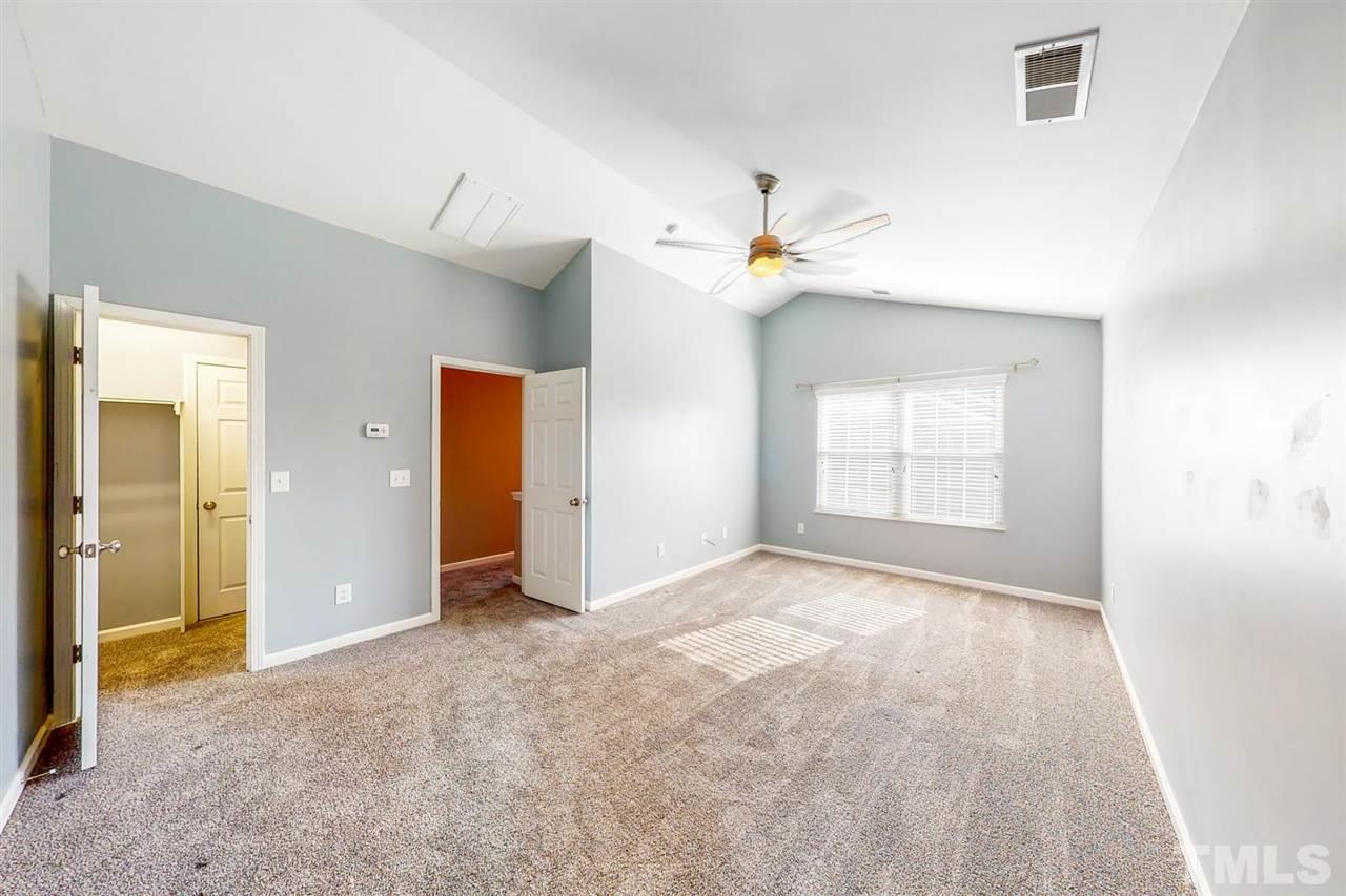 5309 Golden Moss Trail Raleigh, NC 27613 - Photo 16 of 25 an empty room with a bathroom and a window
