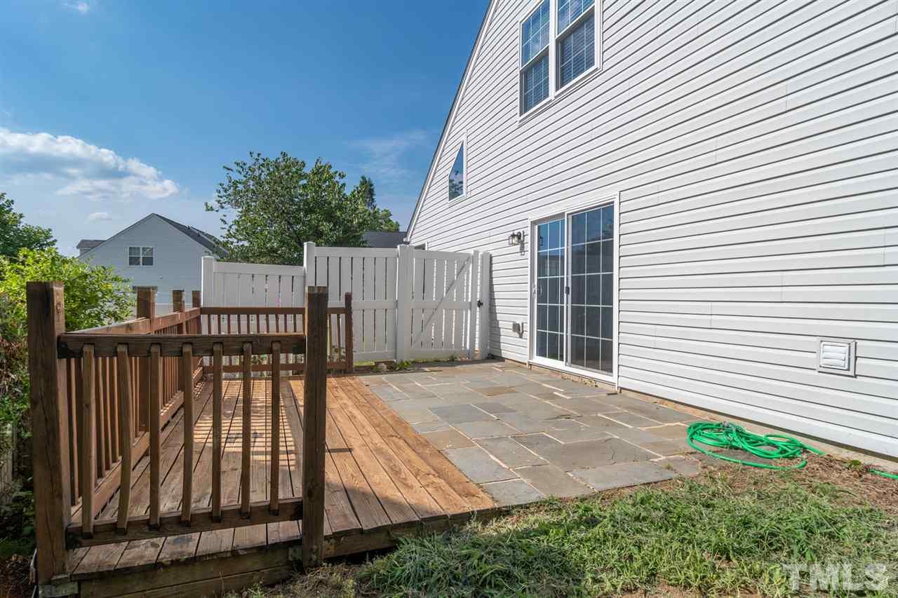 5309 Golden Moss Trail Raleigh, NC 27613 - Photo 22 of 25 a view of backyard with a deck and hardwood