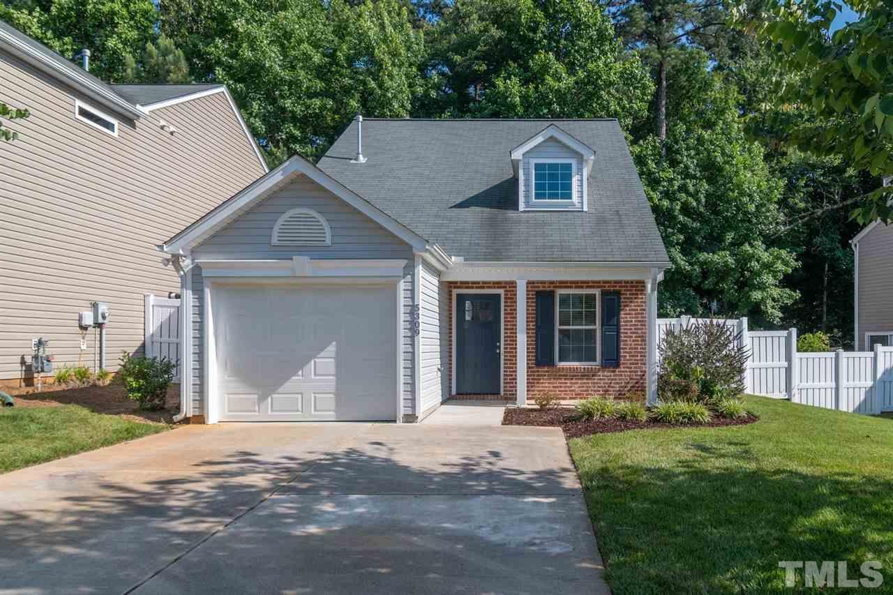 5309 Golden Moss Trail Raleigh, NC 27613 - Photo 23 of 25 a front view of a house with garden