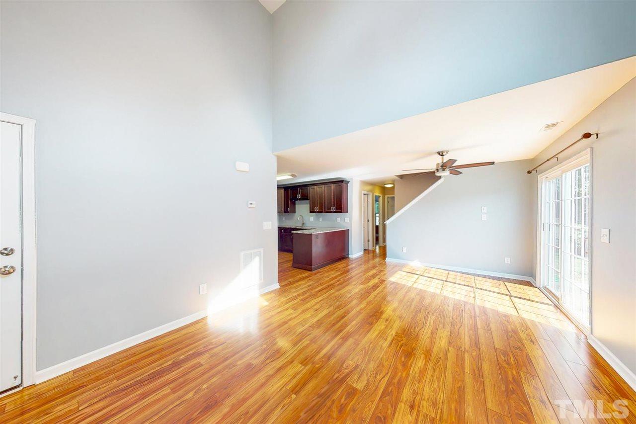 5309 Golden Moss Trail Raleigh, NC 27613 - Photo 7 of 25 a view of a room with wooden floor and staircase