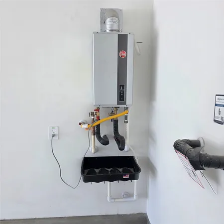 a room with gym equipment and wooden floor