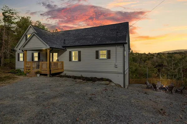 a view of a house with a yard