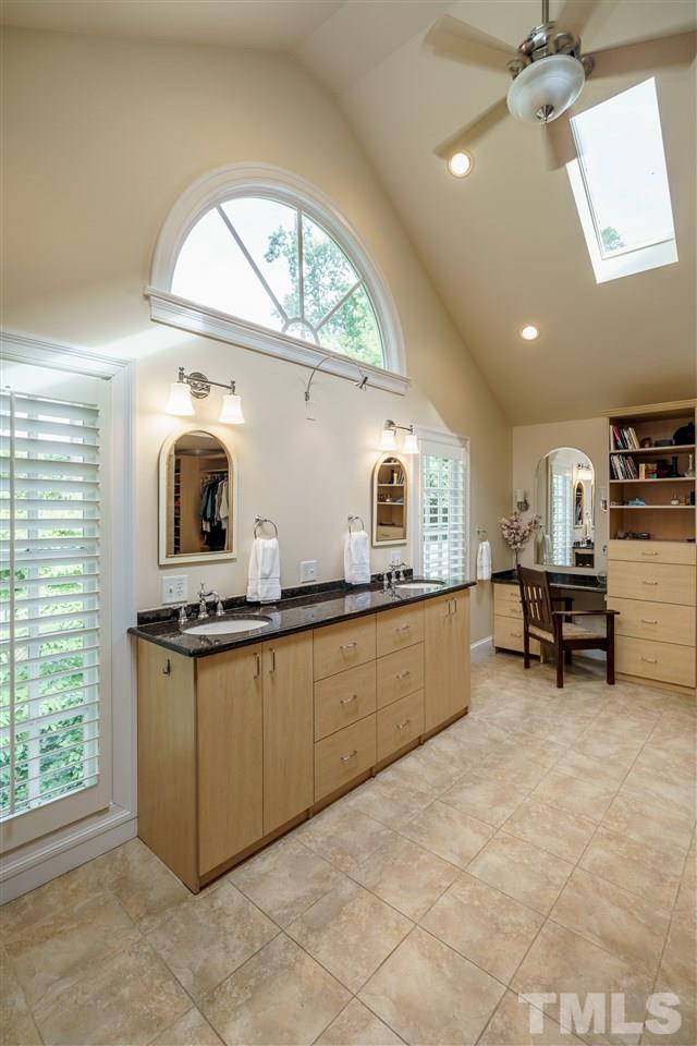 1501 St Marys Street Raleigh, NC 27608 - Photo 15 of 30 Soaring ceiling and natural light define this Master Bath. His/Hers water closets and plenty of space to use as a dressing room. Open-access closet design can be reconfigured (see Documents for alternate design). Massive tiled shower.