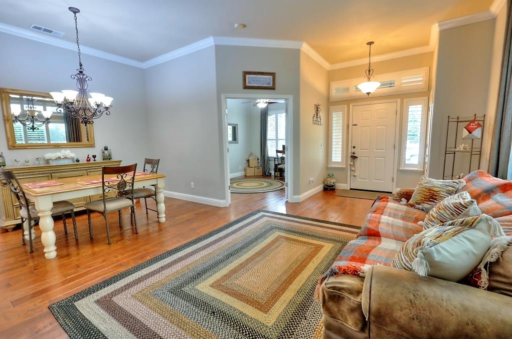 4152 Post Oak Drive Turlock, CA 95382 - Photo 18 of 71 a living room with furniture and a chandelier