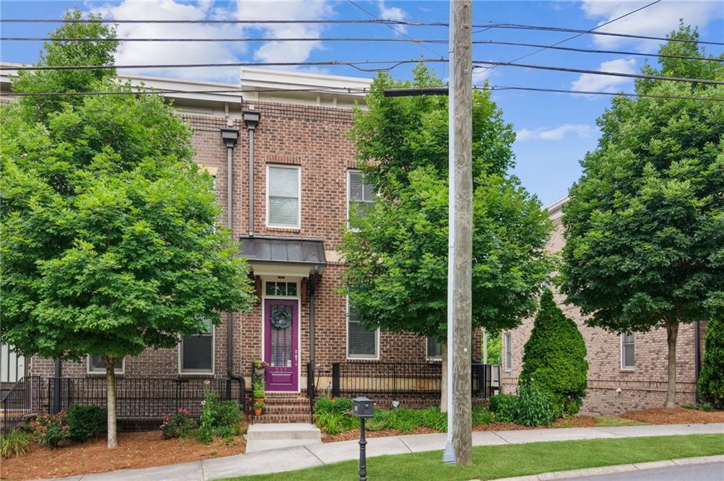 a view of a house with a tree