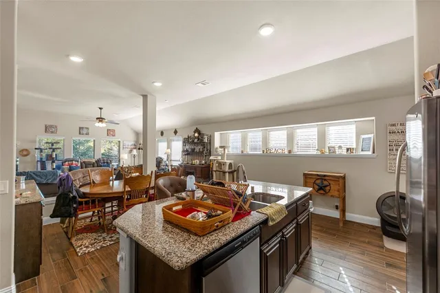 a view of a dining room with furniture and a wooden floor
