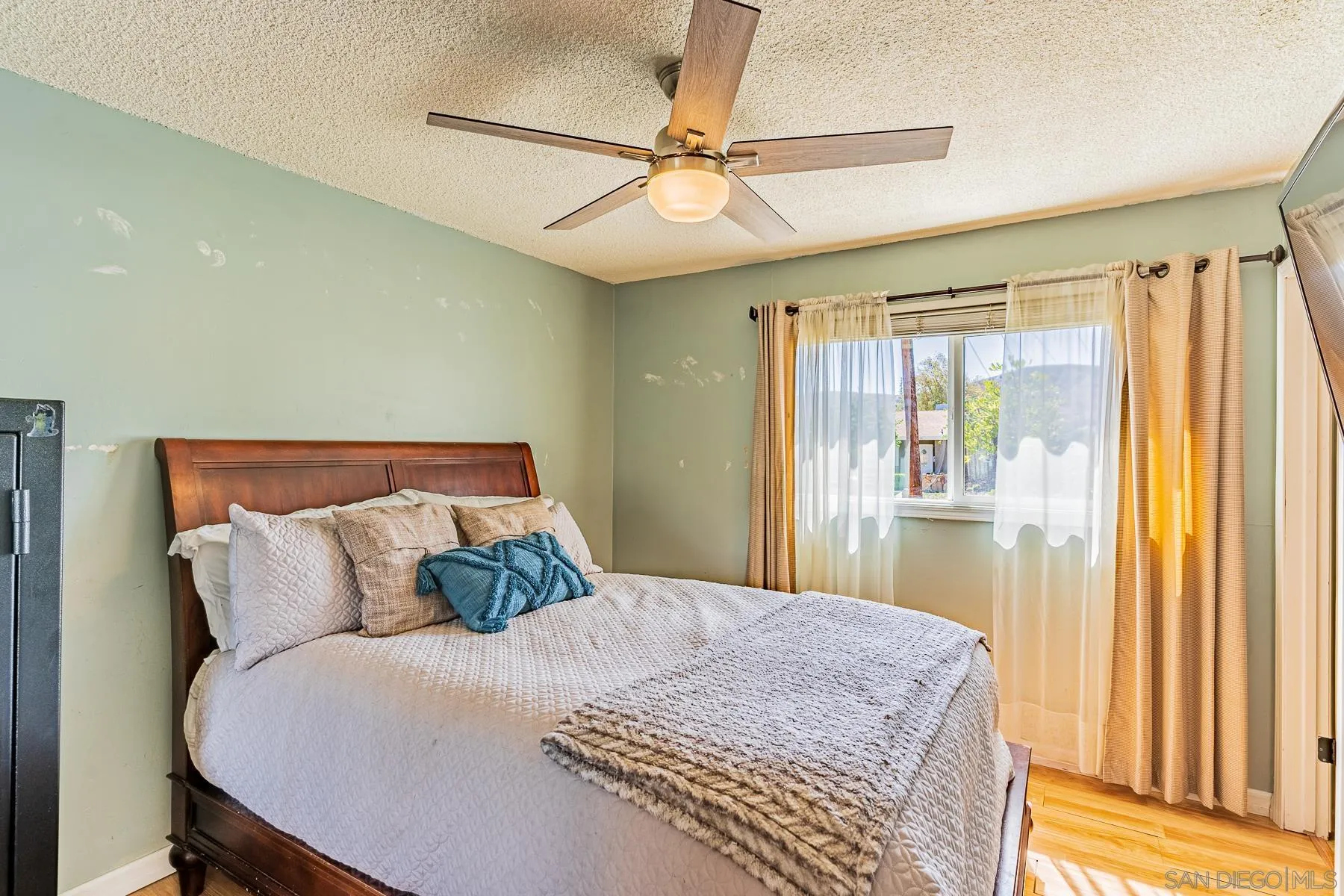9210 Dalehurst Road Santee, CA 92071 - Photo 12 of 25 a bedroom with a bed and window