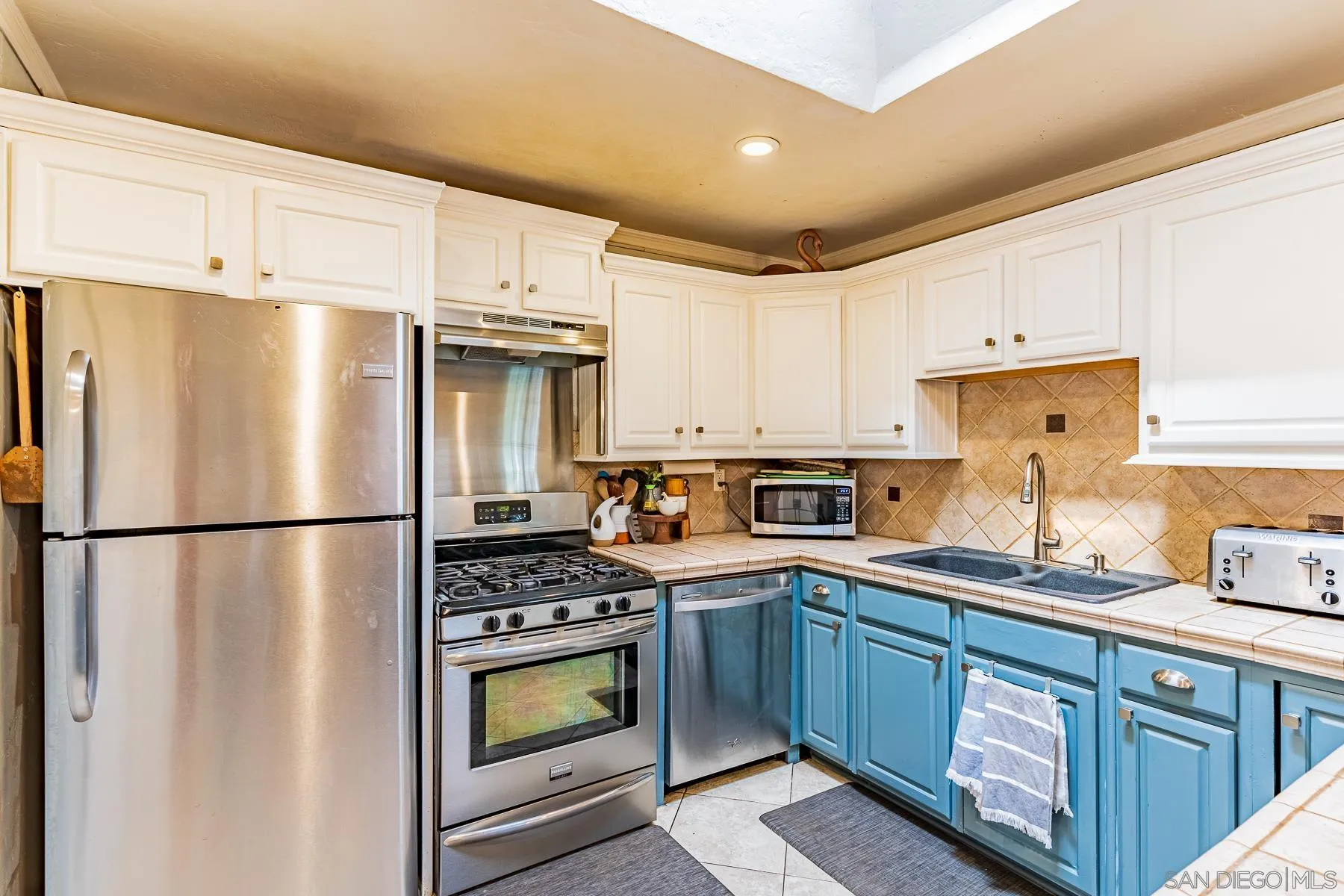 9210 Dalehurst Road Santee, CA 92071 - Photo 8 of 25 a kitchen with stainless steel appliances a refrigerator stove and sink
